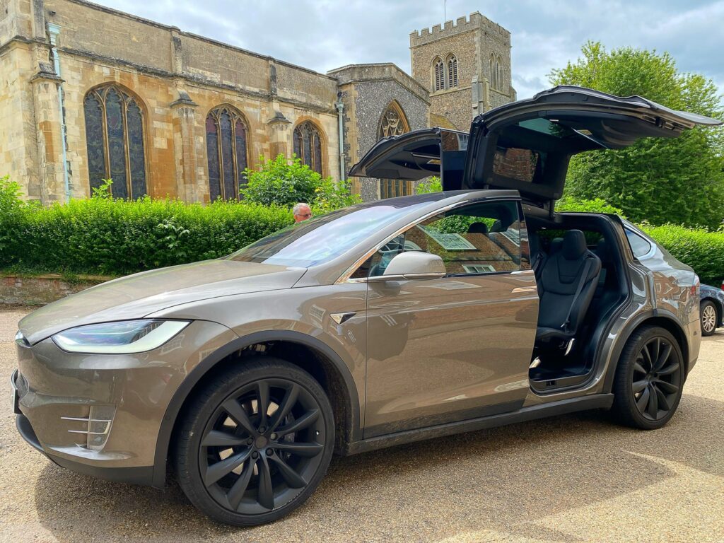 Zero emission electric vehicle used for eco-friendly airport transfers in Cambridge